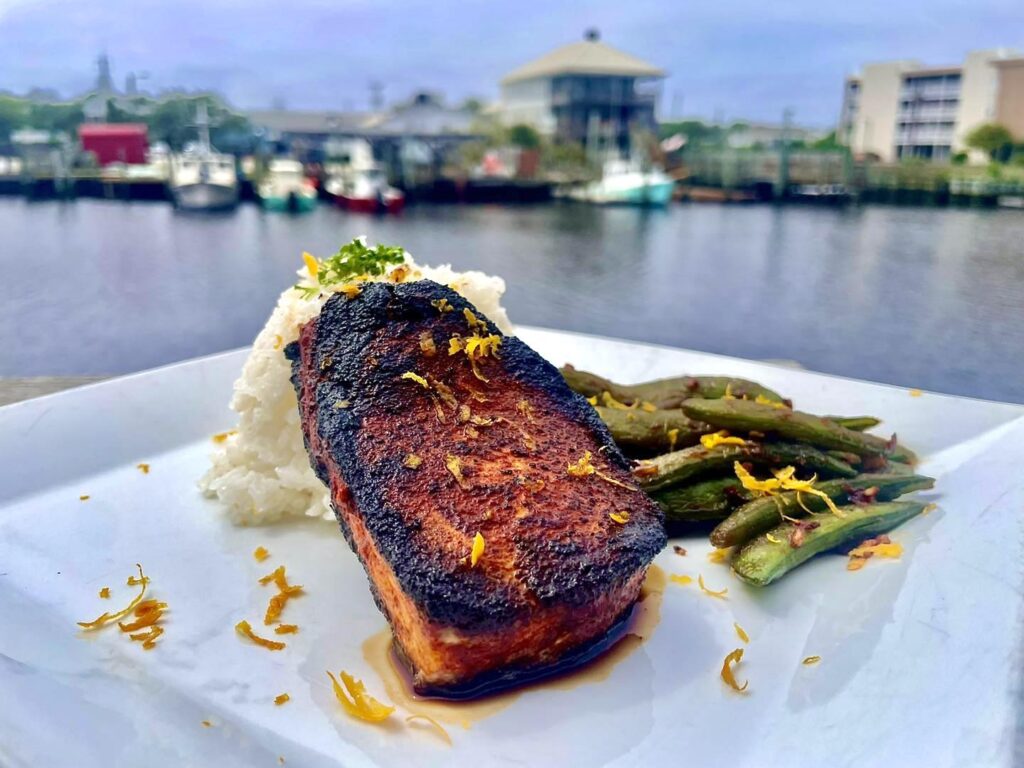 Stoked Restaurant has the Best BBQ Rub NC Caught Local Swordfish with Outdoor Marina Seating and Views and is Located in Carolina Beach, North Carolina near the Carolina Beach Boardwalk